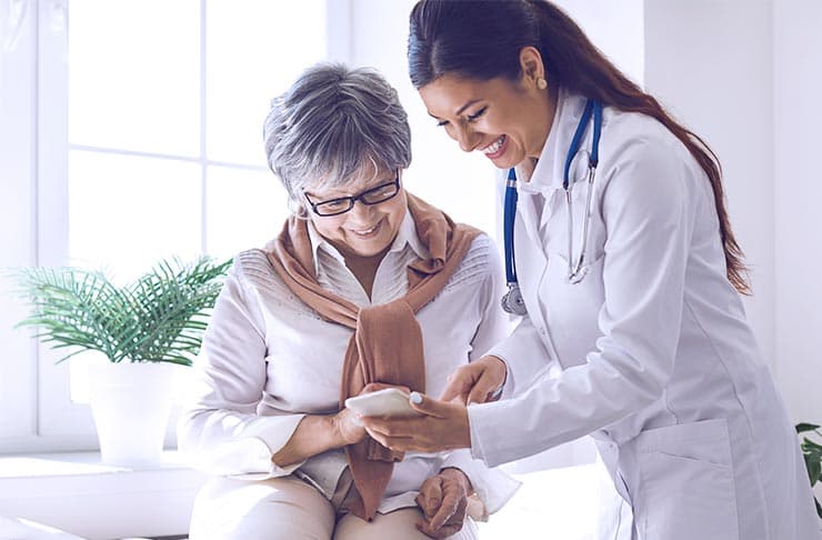 A medical professional speaking with a patient.