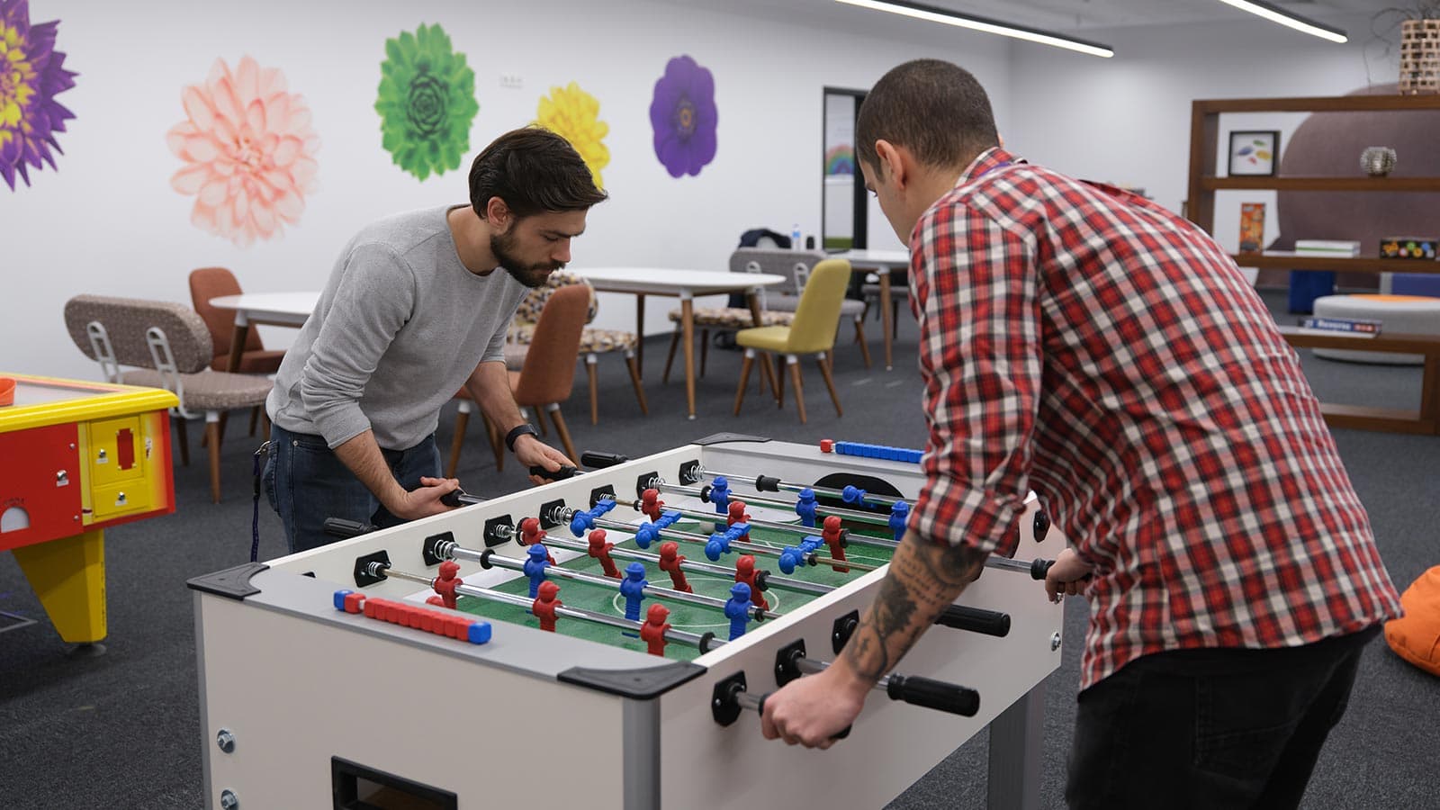 TELUS International team members play fooseball together at one of the Türkiye centers of excellence.