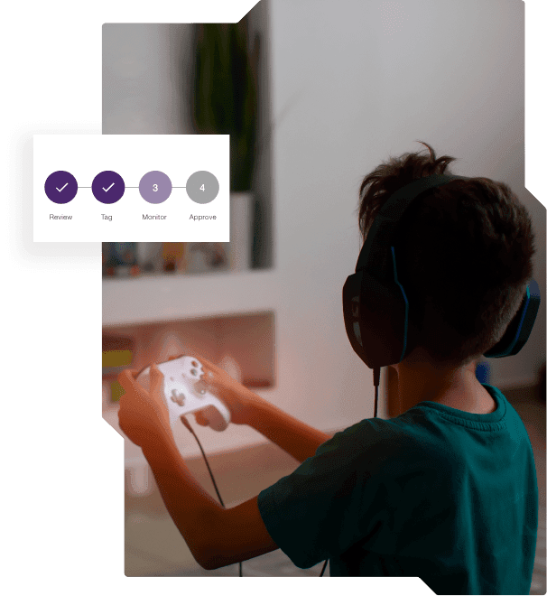 A young gamer playing a game with headphones on