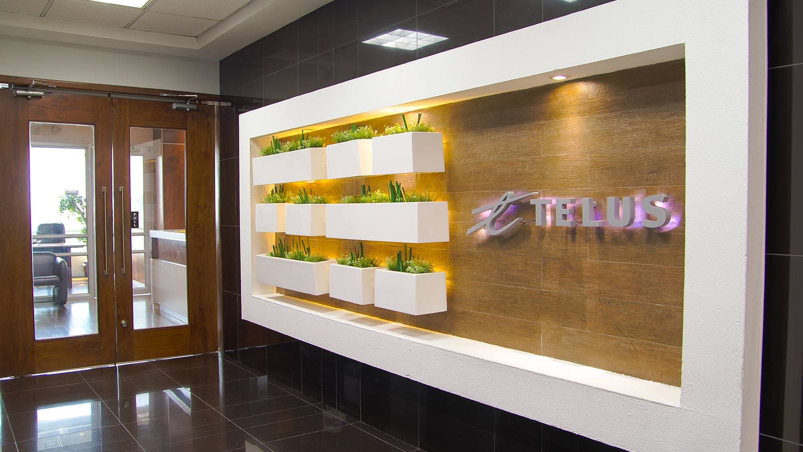 TELUS International logo on a building