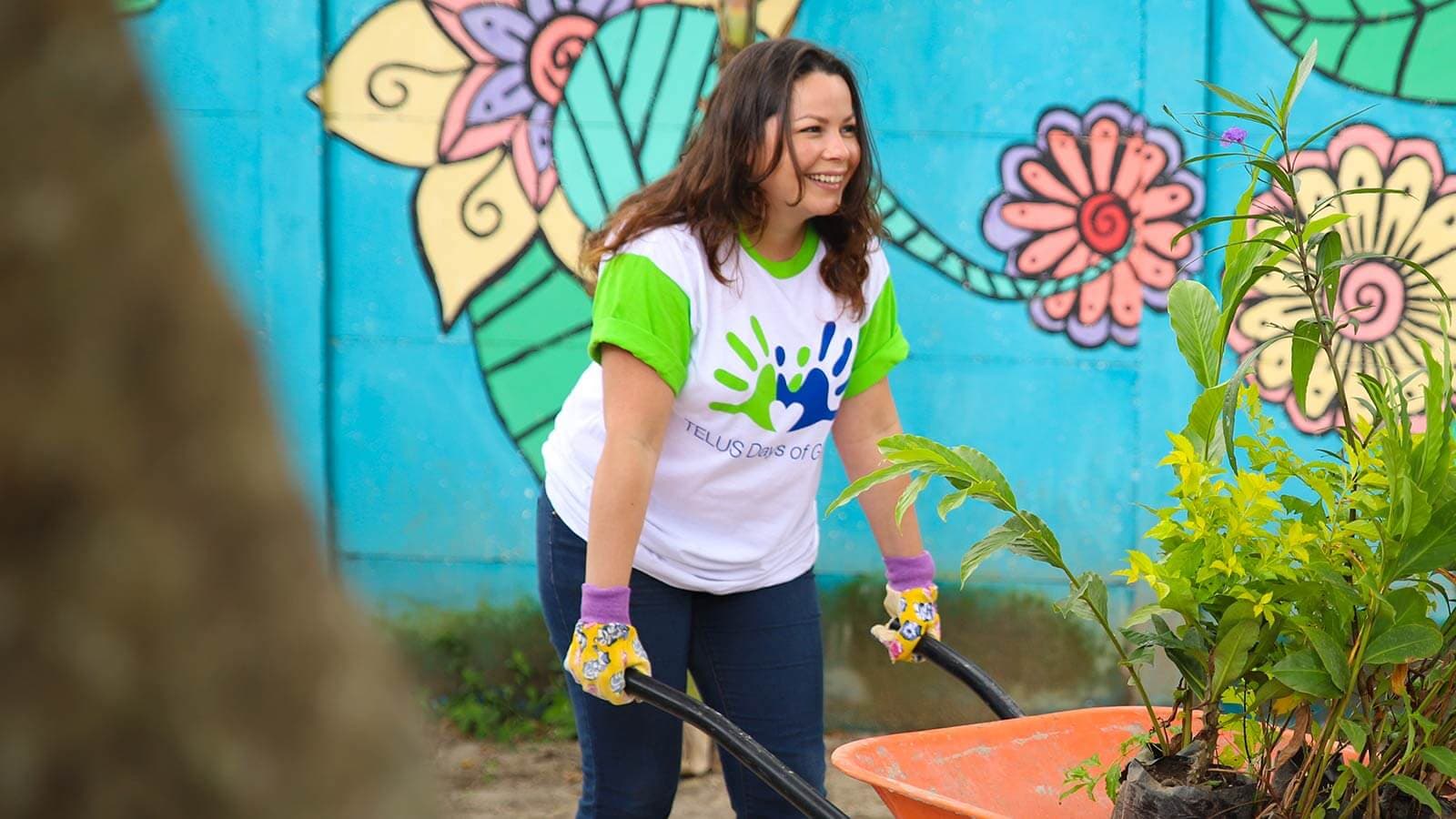 Girl pushing wheelbarrow