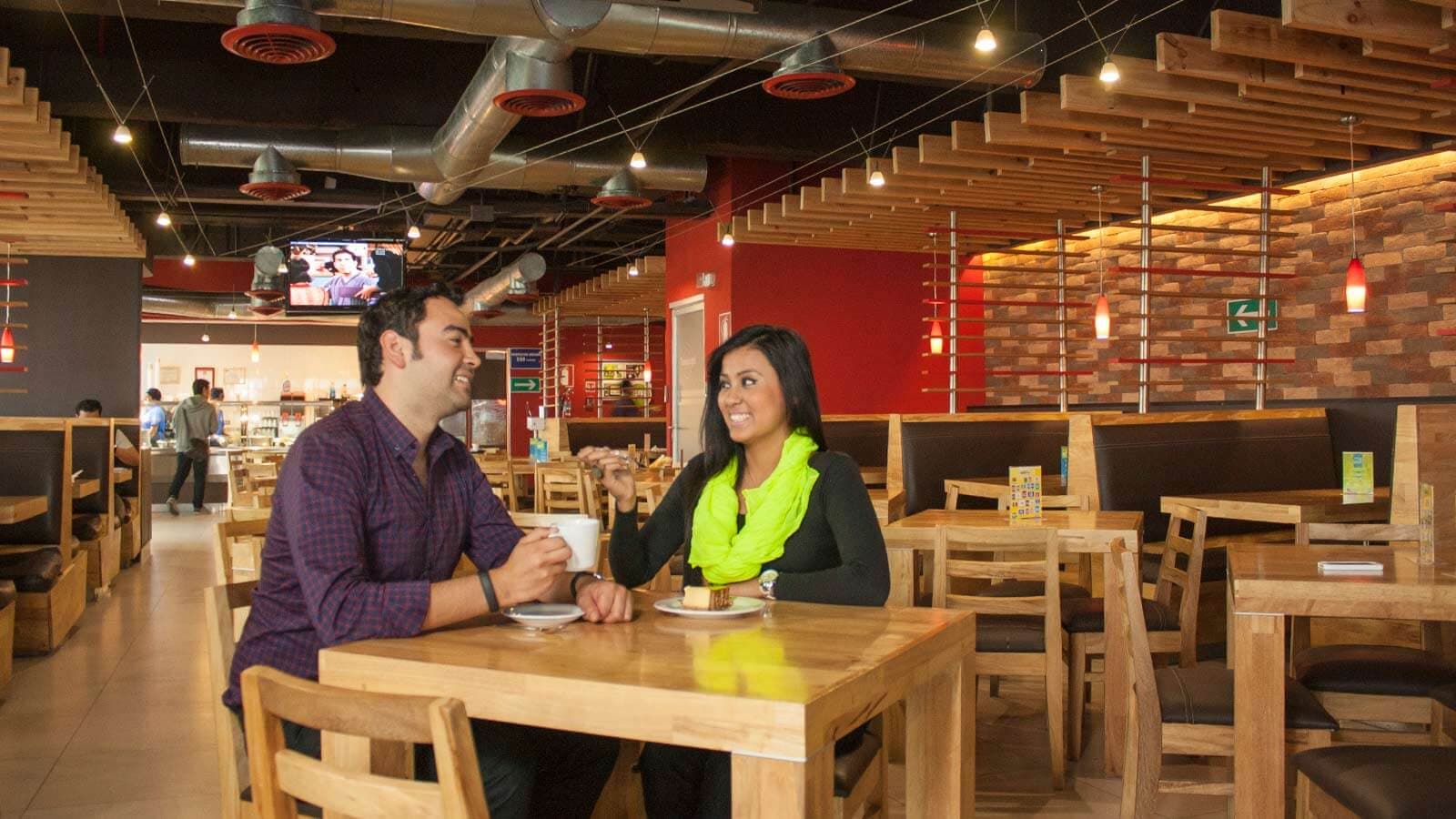 A man and a woman having a coffee in a cafe